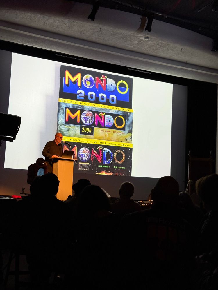 Slide showing three versions of the Mondo 2000 logo