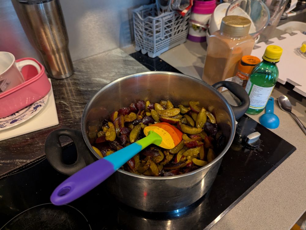 A saucepan full of plums