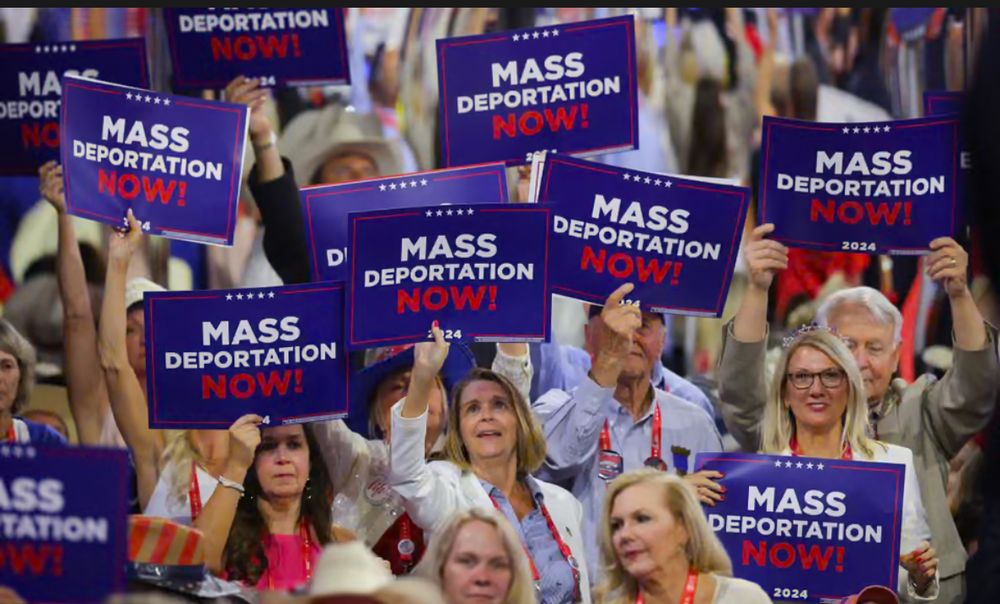 Delegates at the 2024 GOP Convention holding signs “MASS DEPORTATION NOW!”