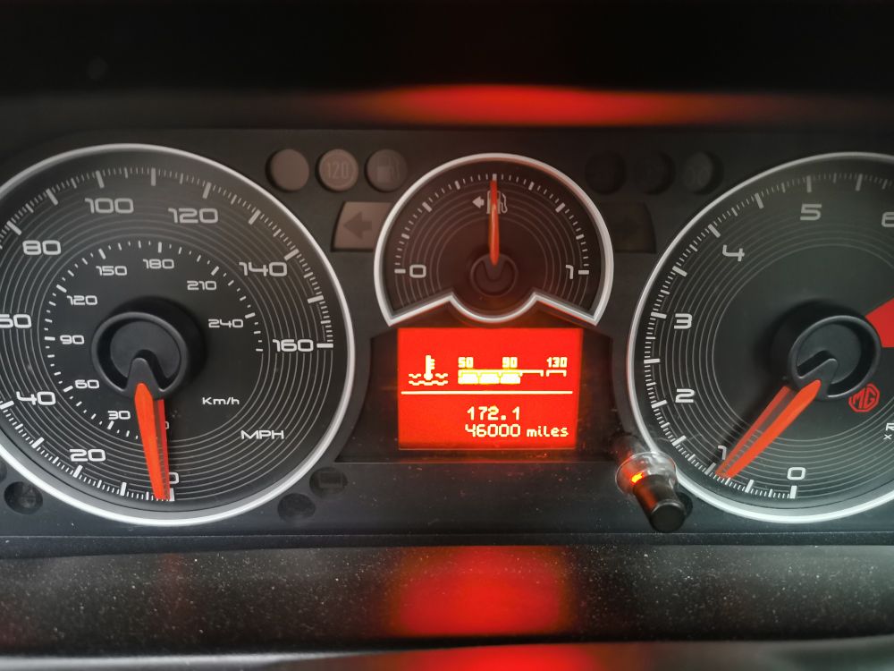 Car instrument panel showing 46000 miles.