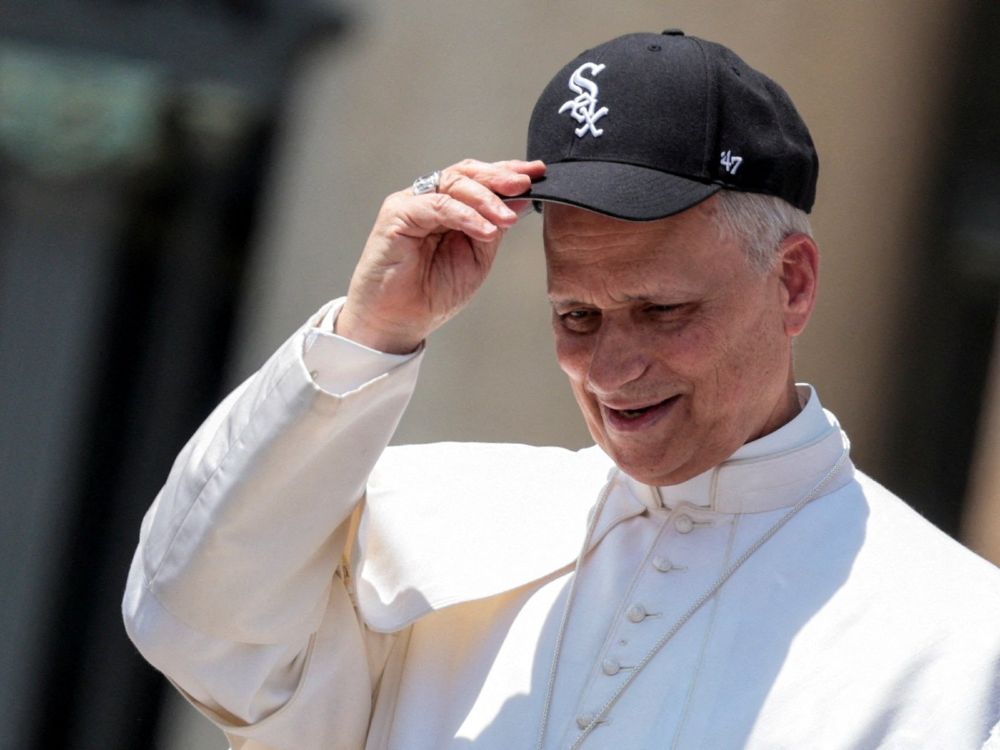 Pope Leo tipping his White Sox baseball cap