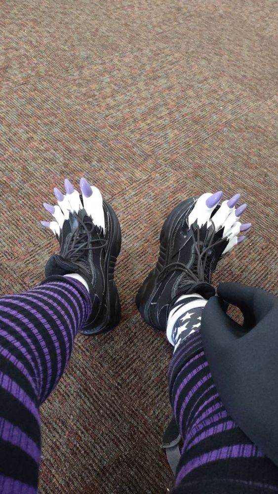 POV: wearing black Demonia 4 inch platform shoes with the fronts torn open and white clown toes popping out of the front.  The toes have shiny purple claws :o)