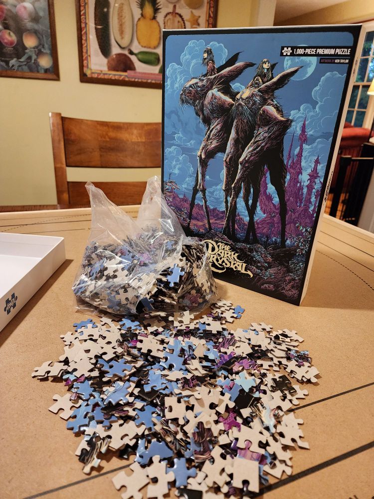 Image of a jigsaw puzzle from the movie The Dark Crystal, showing the pieces spilled out in front of the box
