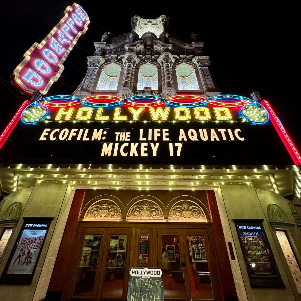 The marquee at the Hollywood Theatre. The marquee reads: ECOFILM: THE LIFE AQUATIC MICKEY 17