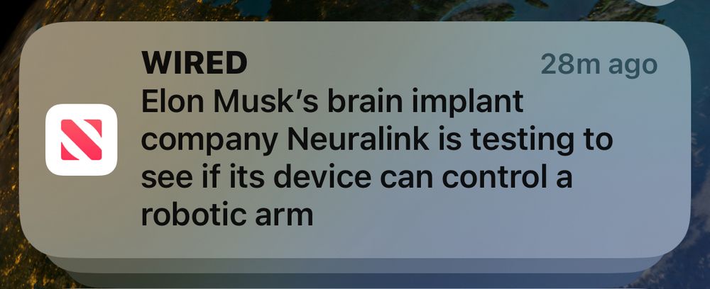 Screenshot of a news notification from Wired that says “Elon Musk's brain implant company Neuralink is testing to see if its device can control a robotic arm.”