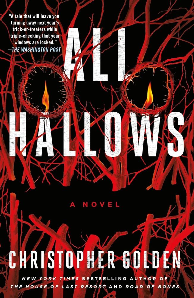 Cover for Christopher Golden's ALL HALLOWS. It's an all black background littered with red tree branches. The branches form a creepy face, with a candle in each "eye". 