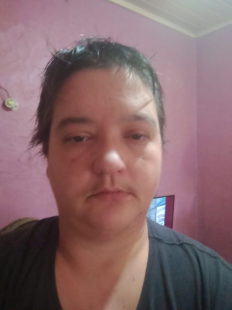 Tired butch dyke with brunette short hair.