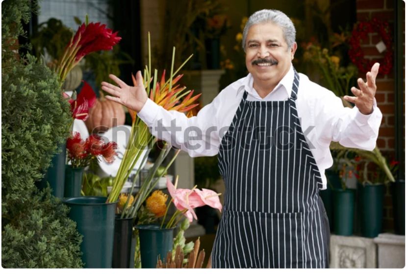 A watermarked stock photo of an older Italian gentleman in an apron, a shop owner of some kind, stepping up with a smile and his arms open in greeting. It’s the same picture every day. Today he is trying to recall the plot of Bunnicula!
