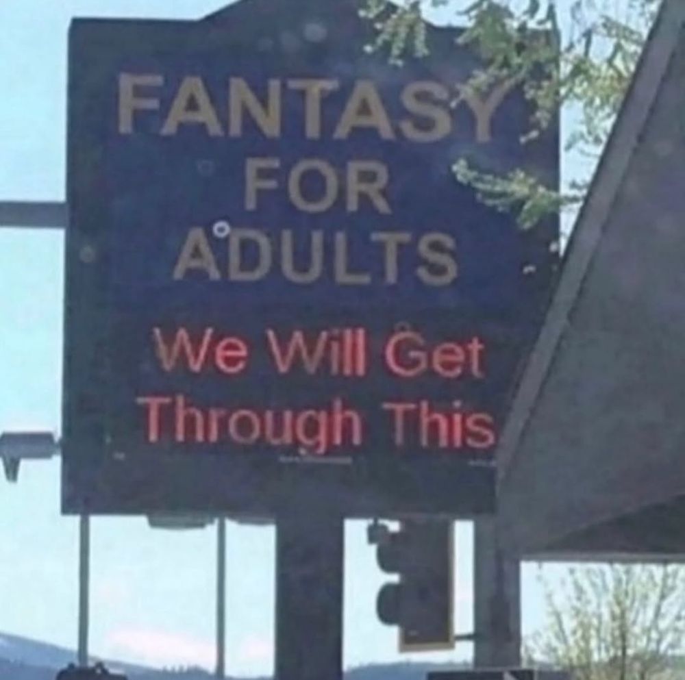An adult bookstore named Fantasy for Adults has a sign that reads, "We will get through this."
If you read the entire sign in order, it reads "Fantasy for Adults We Will Get Through This"