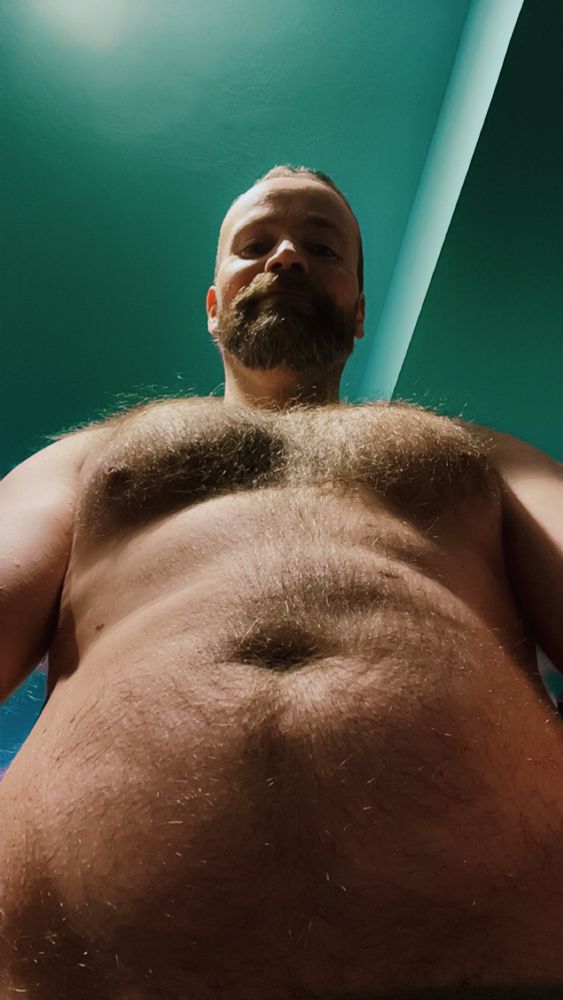 A gentleman showing you his fuzzy chest and belly.