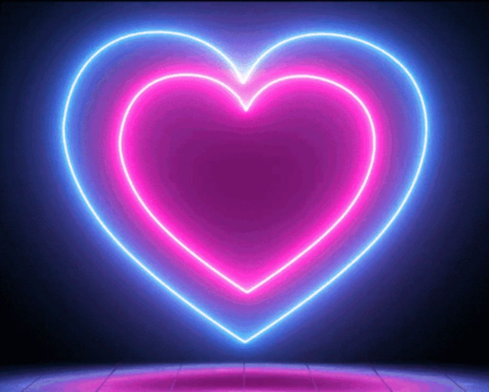 a neon heart is glowing in the dark on a dark background