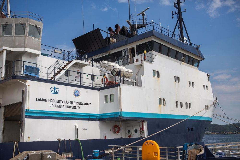 The side of the white and blue research vessel R/V Langseth