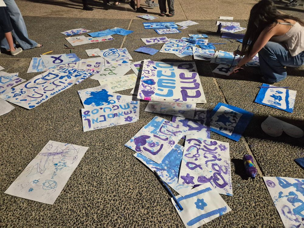 Painting welcome signs on the floor of the square. 
