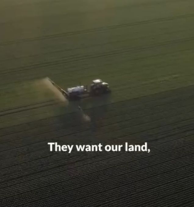 agriculture image, tractor plowing field seen from the air: they want our land