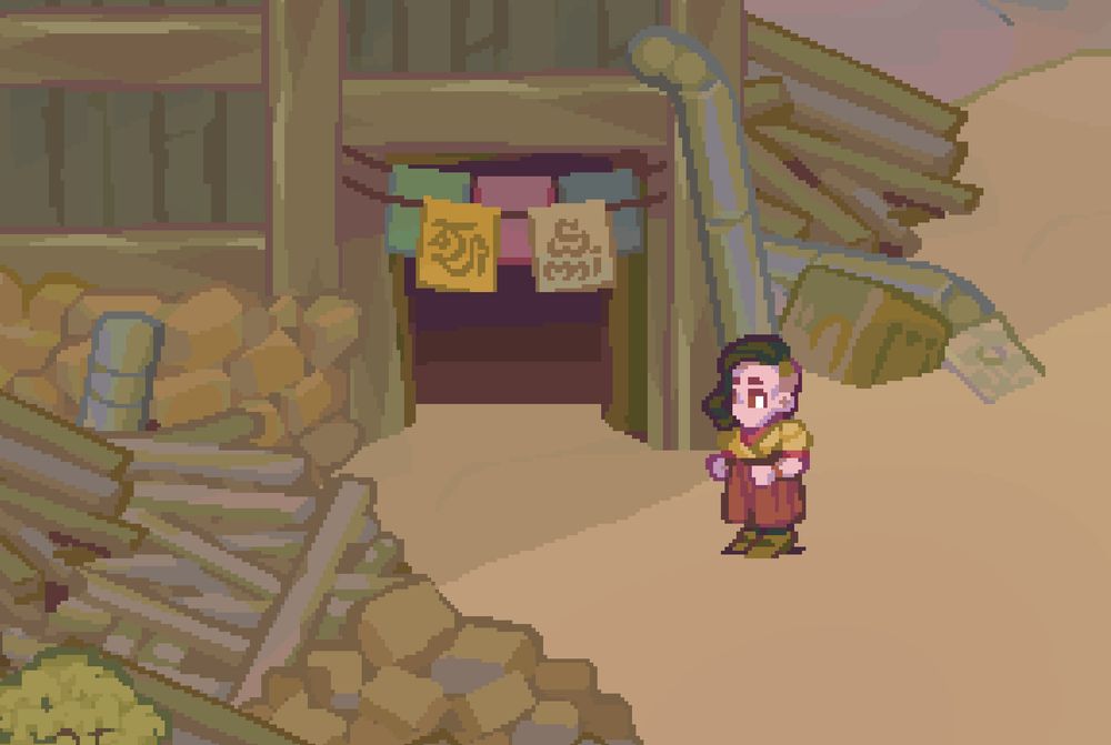 Exterior of a flophouse in Goluglau, a run-down factory town.

Piles of scrap material litter the space, but human touches such as brightly-colored pennants over the door show the place is still cared for
