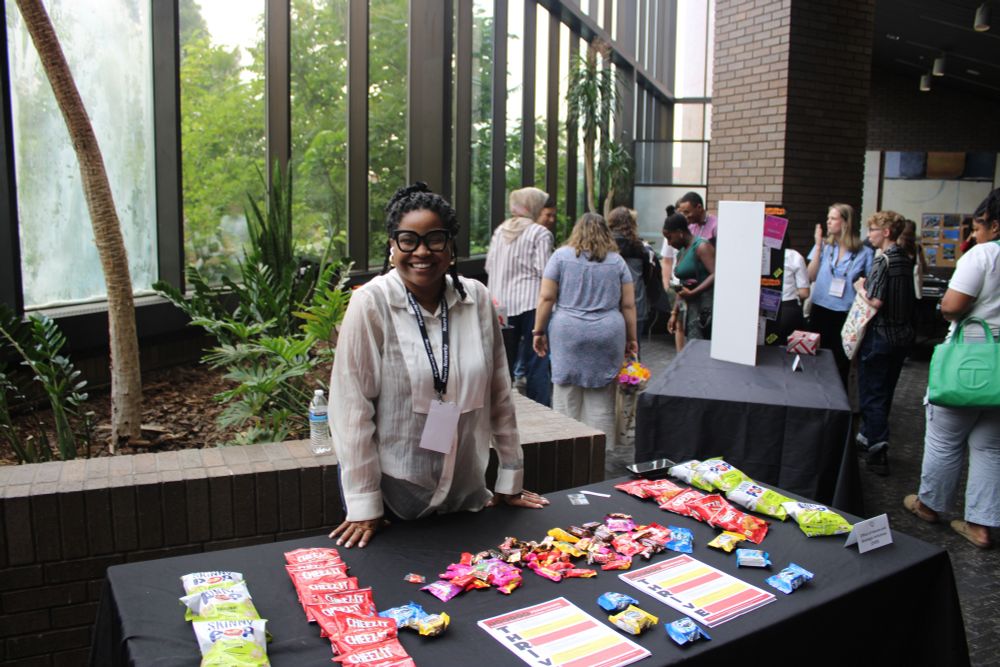One of the marketplace table leads presents her offerings