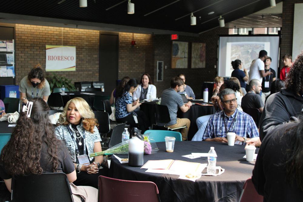 attendees speak at a table during the mentor-mentee session