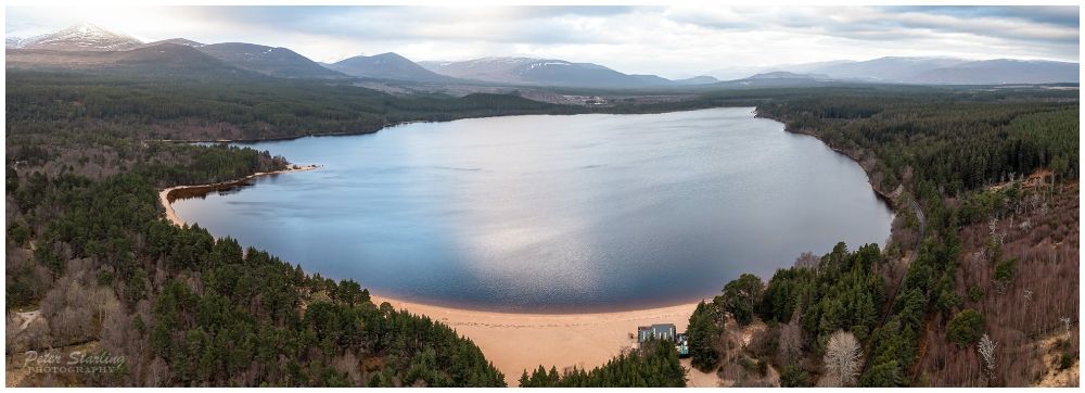 A panoramic aerial view of Loch Morlich.