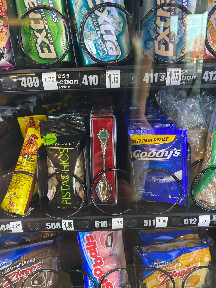 A vending machine with an option to purchase a small decorative spoon for $3.75
