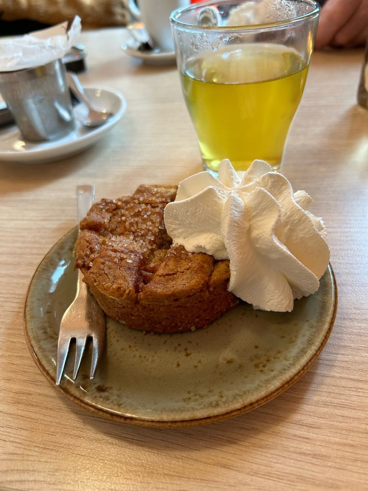Gluten free apple pie with whipped cream and tea