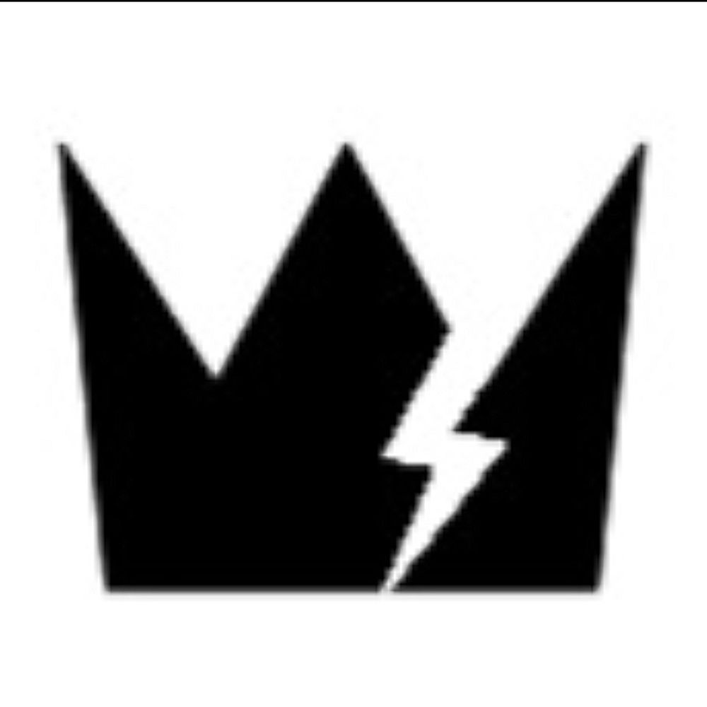 Image shows a black symbol of a crown on a white background being broken by a white lightning bolt.