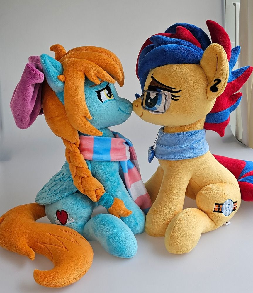 MePlushYou plushies of Skydream and Mikaela. They are posing sitting down and booping snoots.