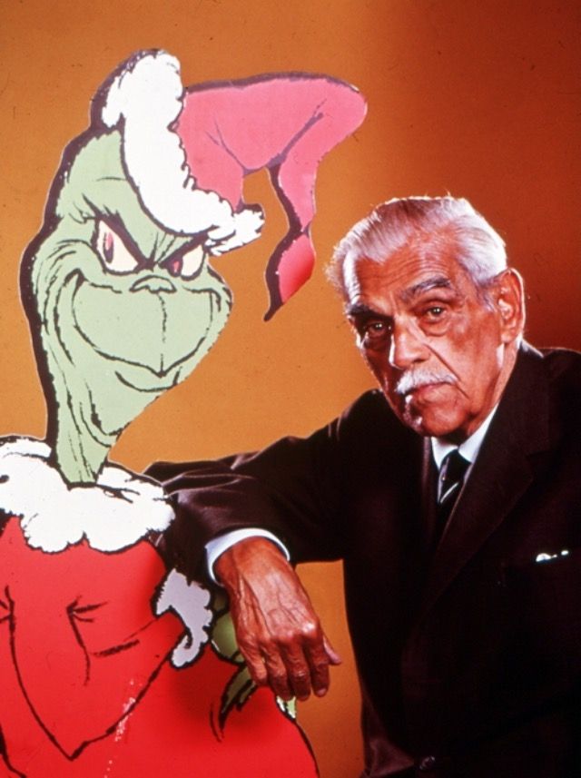 The cartoon Grinch from the original TV special alongside Grinch actor and narrator Boris Karloff.