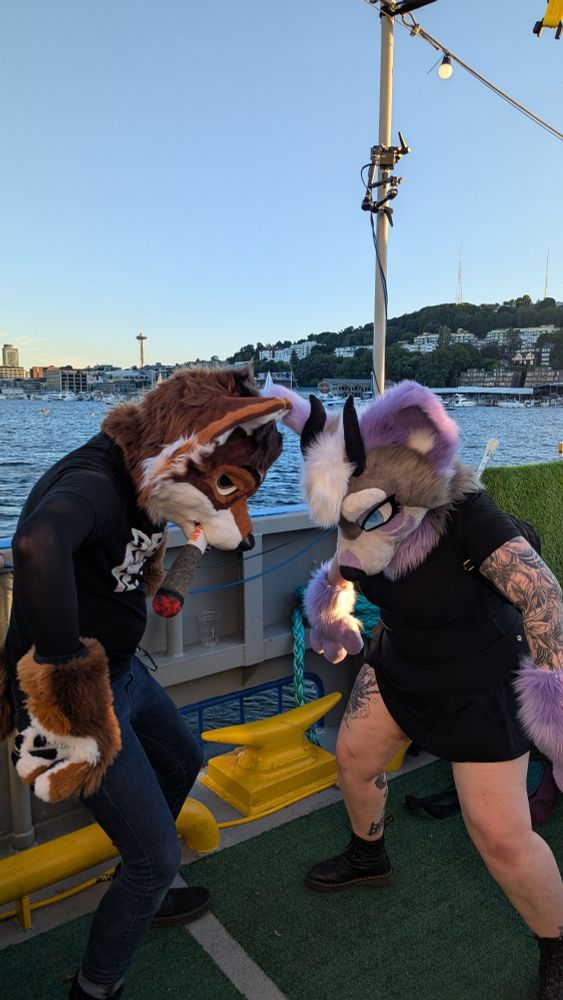 Juno and Orion make a very silly stance on the deck of the Hiyu 