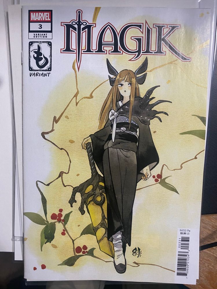 Alt text: A Marvel comic book titled Magik. The title character is pictures, wearing a black kimono. She is stepping forward and her right hand rests lightly on the pommel of an impractically large, wide-bladed, yellow sword.