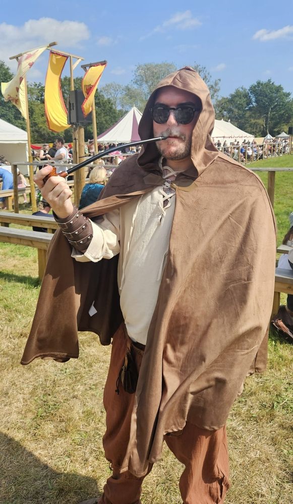Me dressed up at the Loxwood Joust, smoking a pipe.