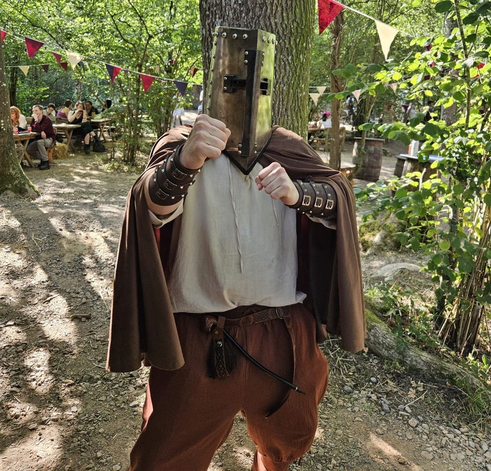 Myself at the Loxwood Joust, wearing a giant helmet.