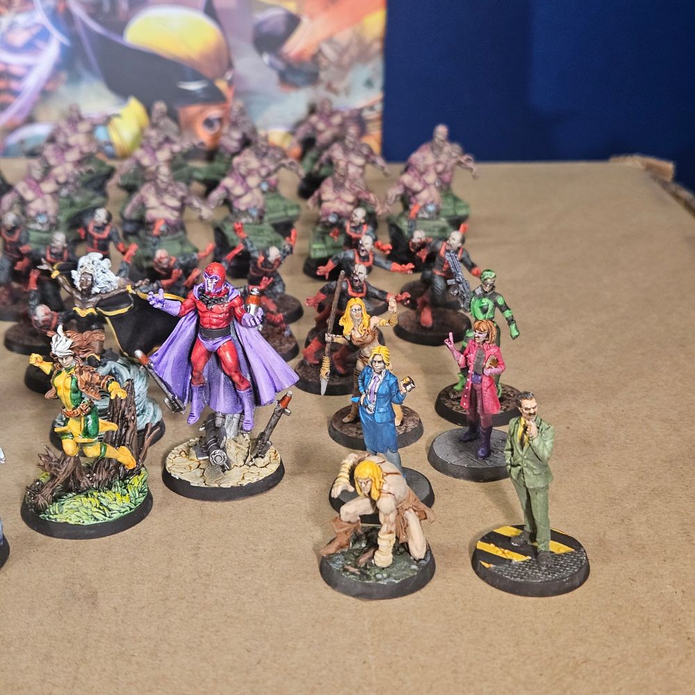 X-men Resistance painted miniatures, on a cardboard box.