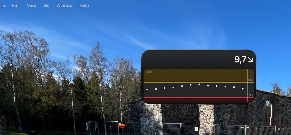 Mac OS:n työpöytä, jossa näky verensokerin olevan 9.7 mmol/l, hieman laskeva
