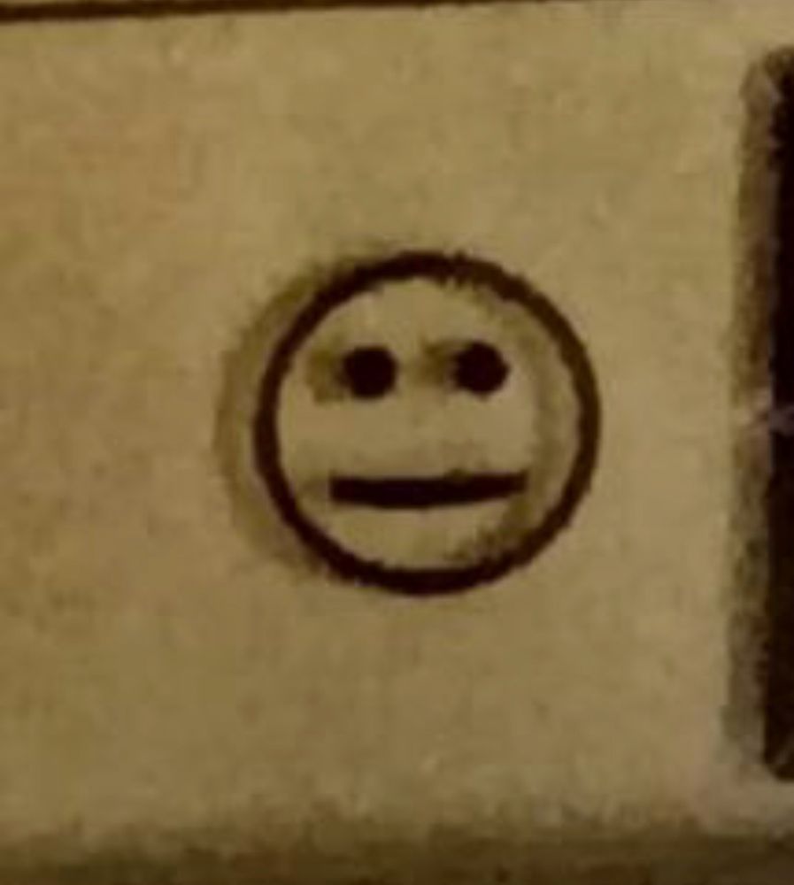closeup of the straight faced emoji of the sensor lcd