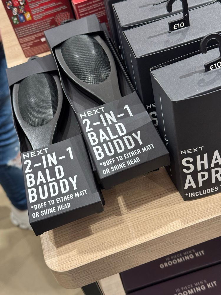 what looks kinda like a hairbrush/lint roller, but is instead for a bald head to shine the bald headed person or matte it