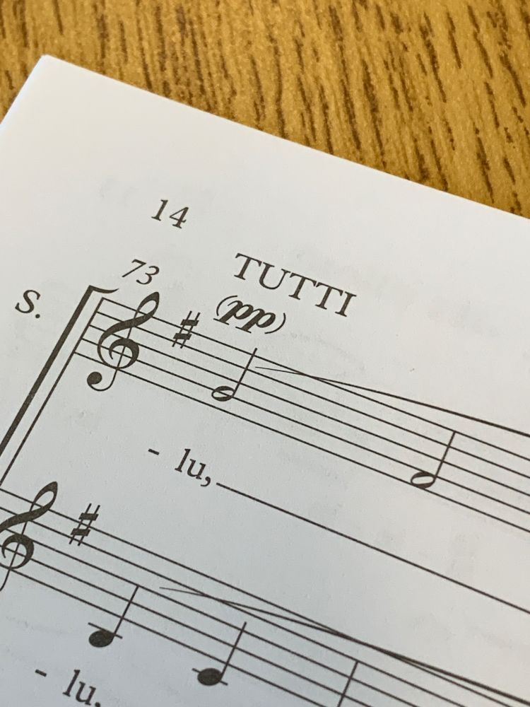 A sheet of music noting “TUTTI (pp)”