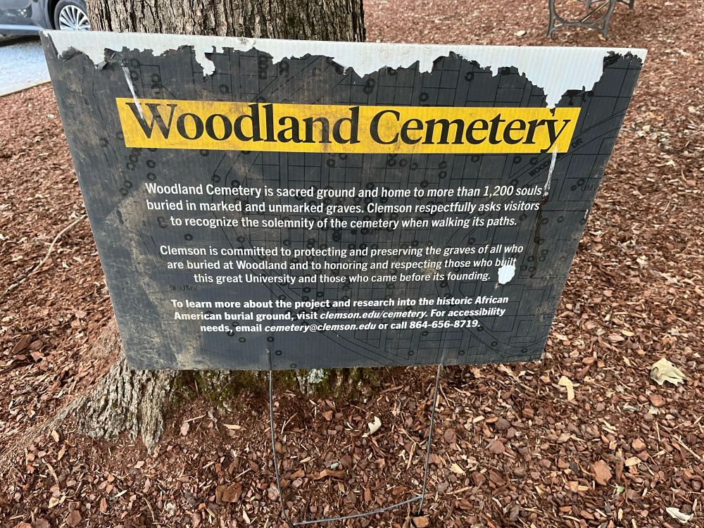 Sign describing the history of Woodland Cemetery at Clemson University