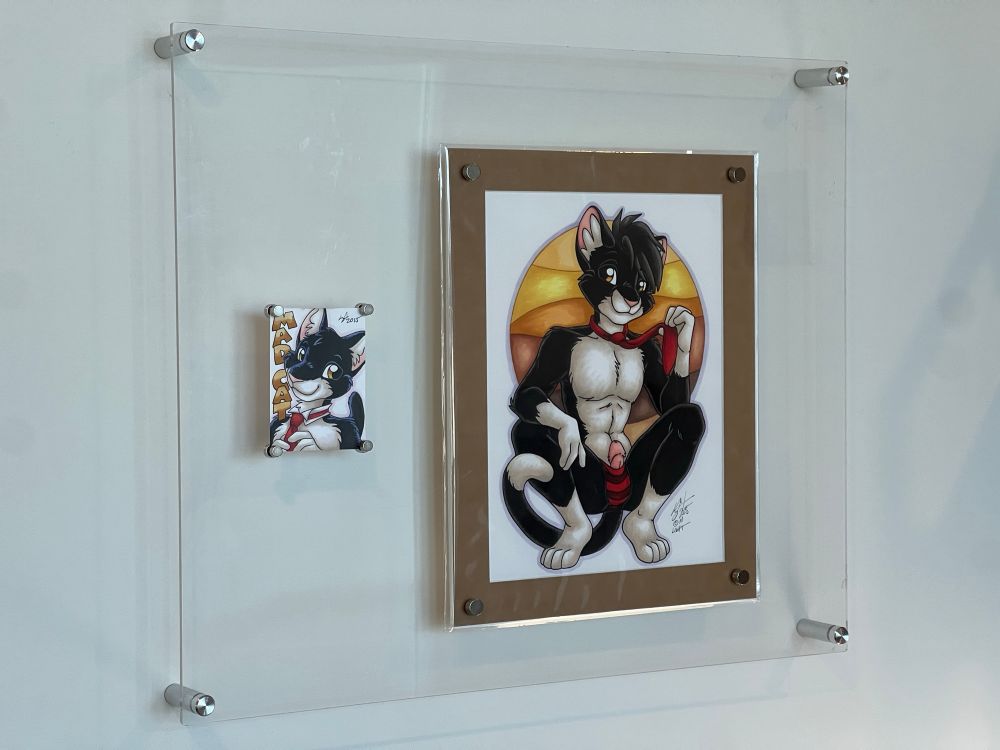 A badge, and full body art of an anthropomorphic black and white tuxedo cat 