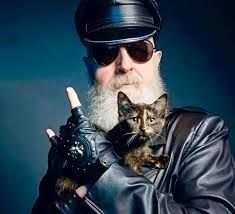 Rob Halford, lead singer of the heavy metal band Judas Priest, holding a kitten.