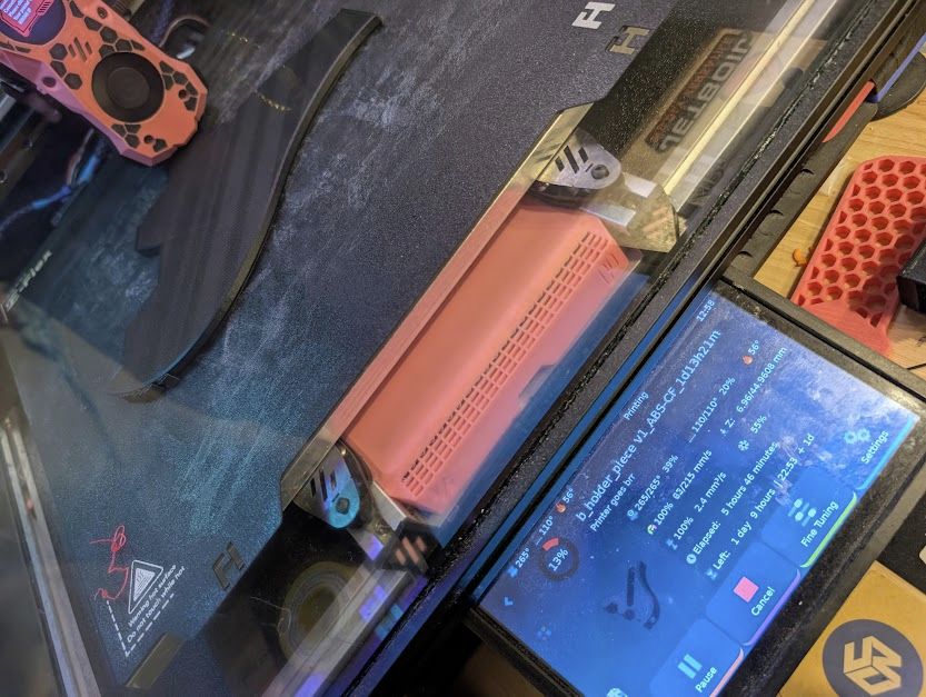 a guitar body part being printed on @jessicaeh.bsky.social's voron