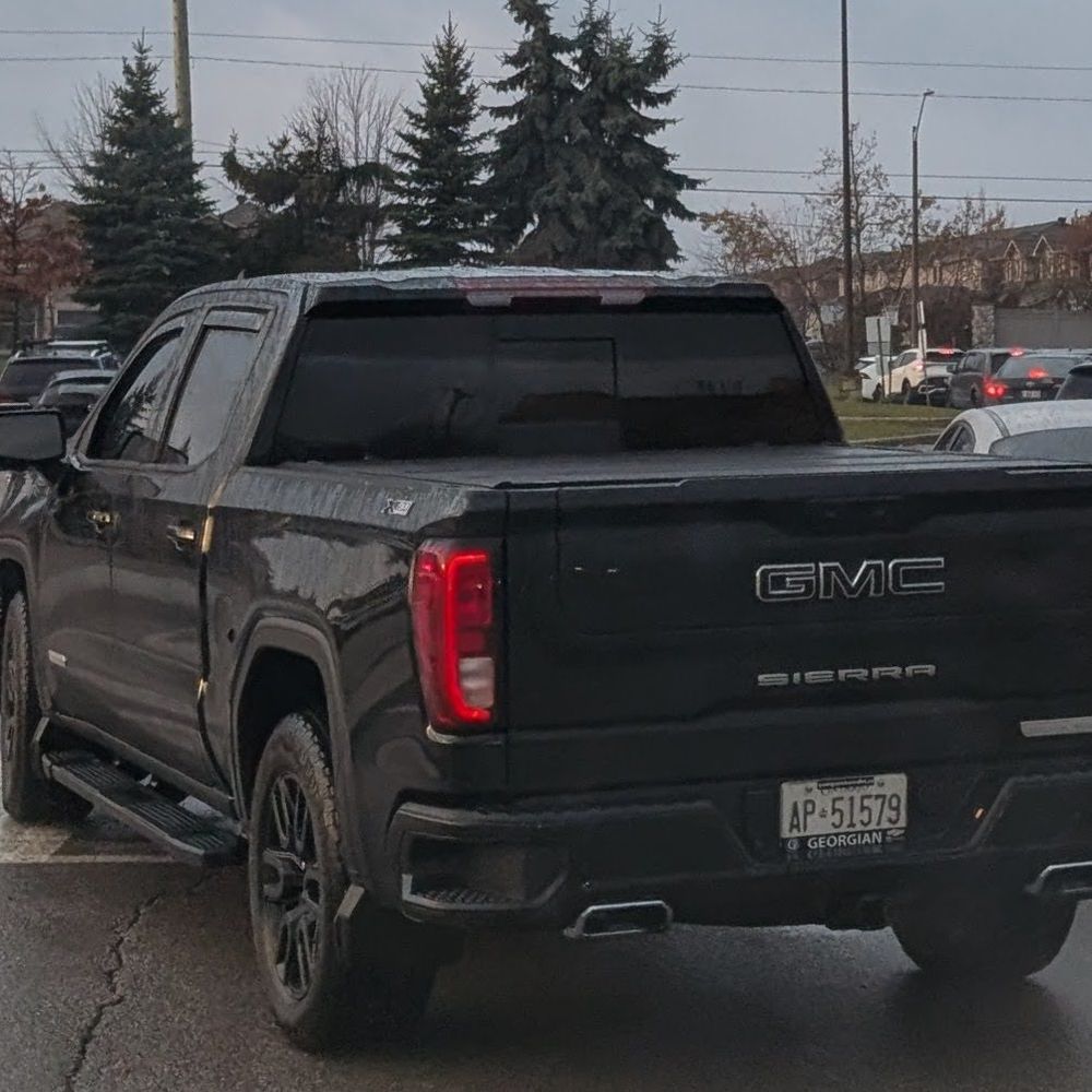 black gmc sierra ontario plates ap 51579 that nearly hit a child and screamed slurs at staff in a school parking lot in the south end of barrie, ontario, canada