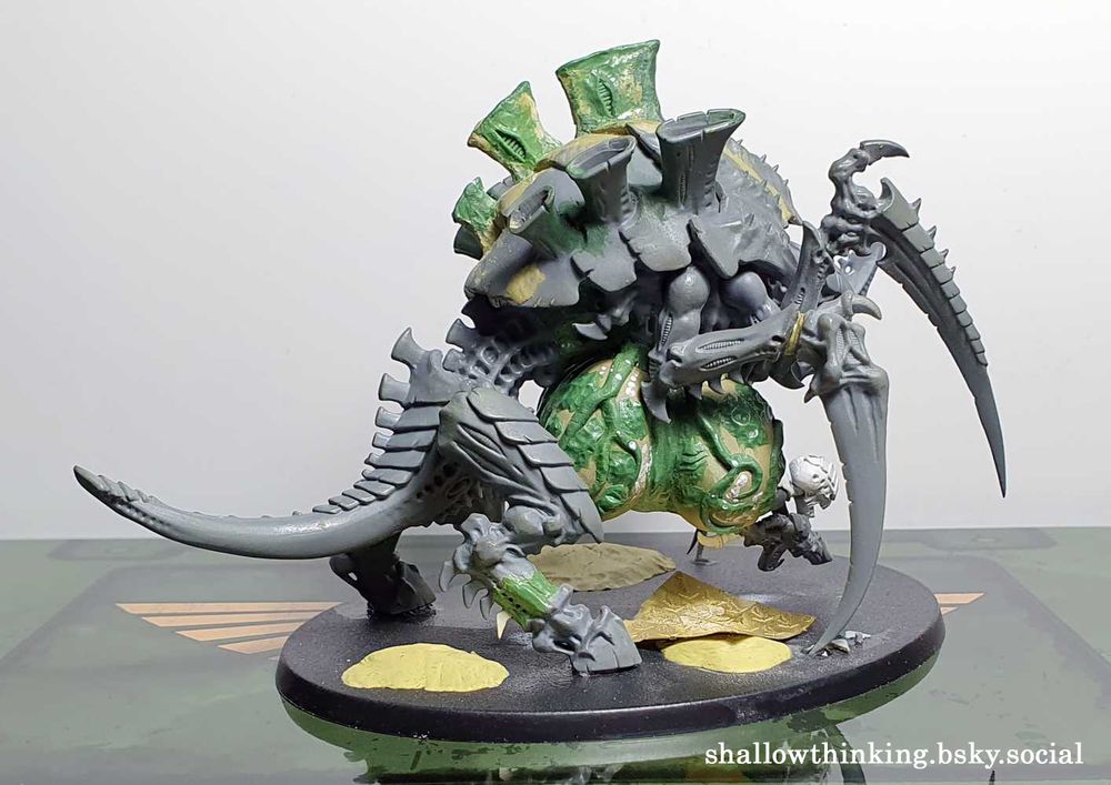 A Tervigon model which has been made by extending the carapace and legs of a Carnifex and adding a disturbingly pendulous 4-lobed egg sac underneath.