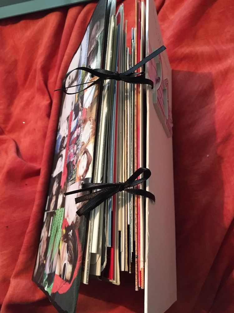 Cards stacked on top of each other. They are tied with black string.