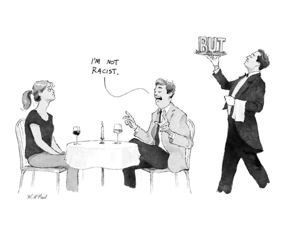 A single panel cartoon of a couple on a date at a restaurant. The man explaining to his date, “I’m not racist…” as a waiter approaches to deliver a well timed plate of the word “BUT.”