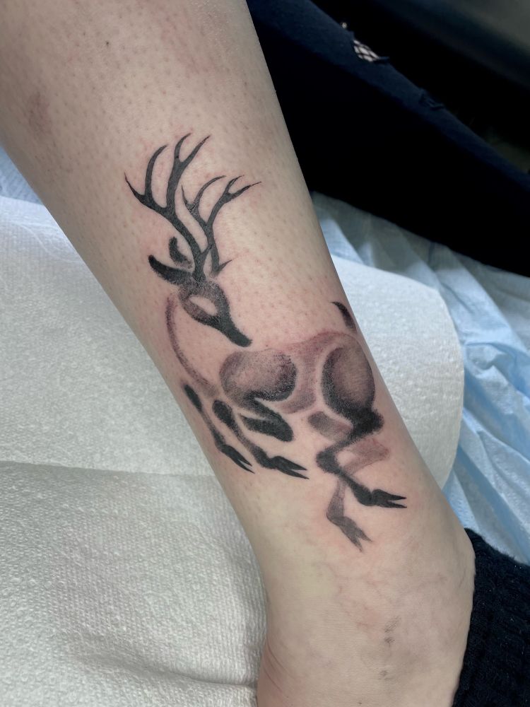 Softly shaded greywash deer tattoo, with no outlines. 