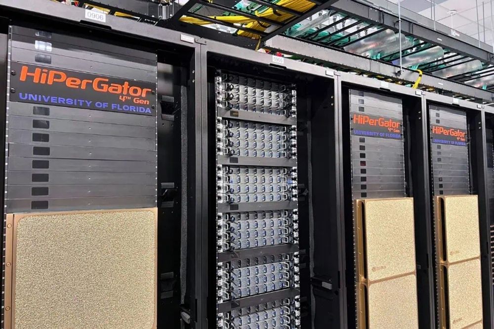 A row of gold-faceplate server racks with a sign at the top of each rack saying “HiPerGator”