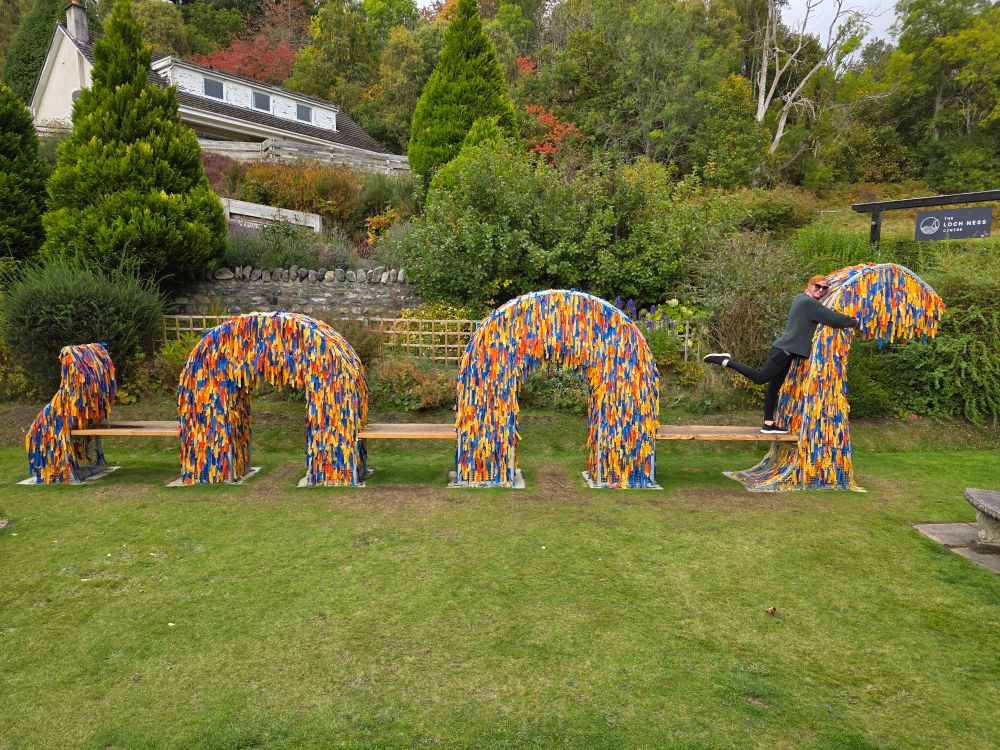 Loch Ness Monster art piece where visitors can tie different colored ribbons based on their belief level in the Loch Ness Monster.