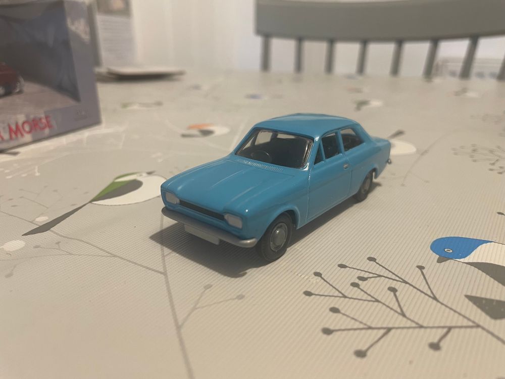 A small model of the Ford Escort MK I Saloon car, in a light blue colourscheme