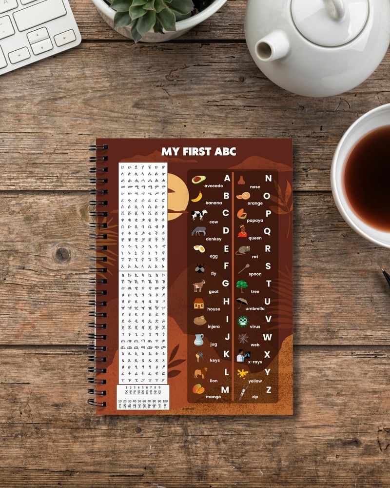 Fidel Amharic alphasyllabary and English alphabet design printed on a high quality spiral bound notebook