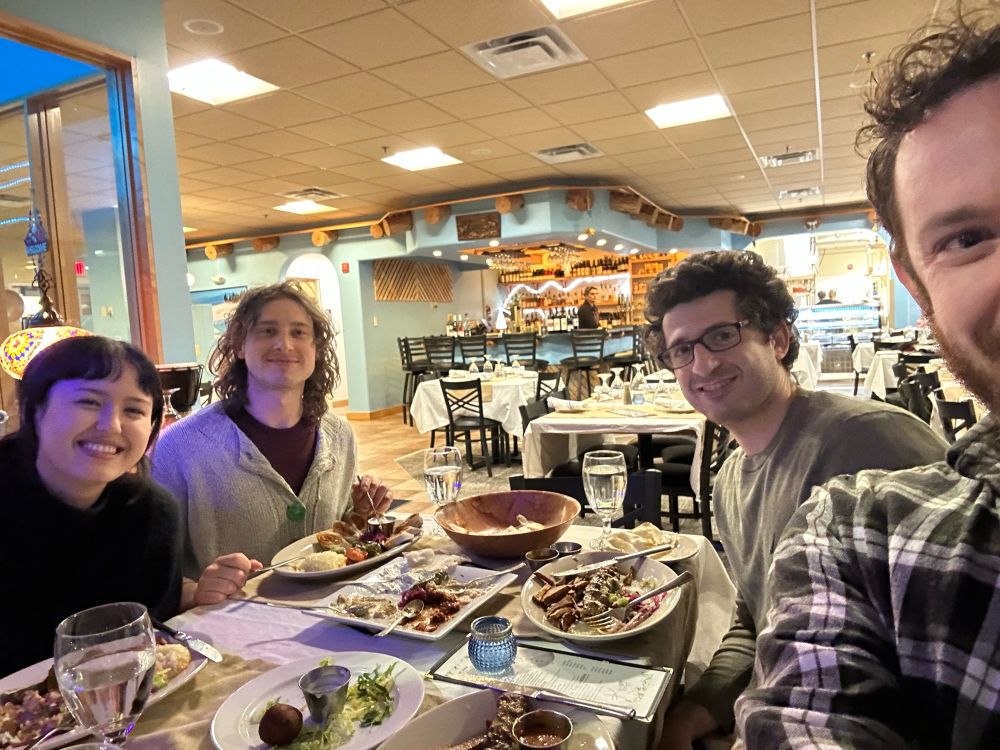 A group of people share a meal. 